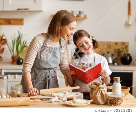 Positive family loving mother and daughter cooking together Positive family loving mother and daughter cooking together 90515885