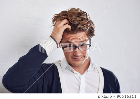 Im confused.... A young man with messy hair looking perplexed. Im confused.... A young man with messy hair looking perplexed. 90516311