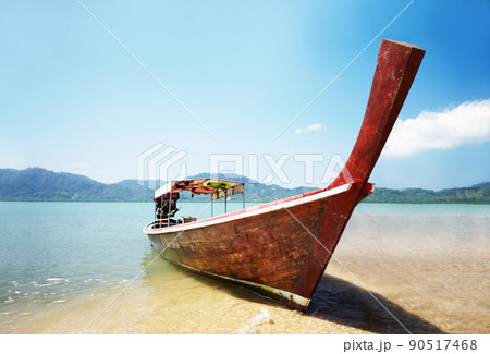 Traditional Thai boat. Traditional Thai long tail boat on the beach - Thailand. 90517468
