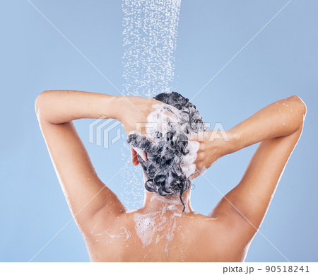 I shampoo twice and only apply conditioner once. Shot of an unrecognisable woman washing her hair. I shampoo twice and only apply conditioner once. Shot of an unrecognisable woman washing her hair. 90518241