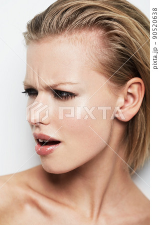 What did you say. An young woman looking at something with offense. What did you say. An young woman looking at something with offense. 90520638