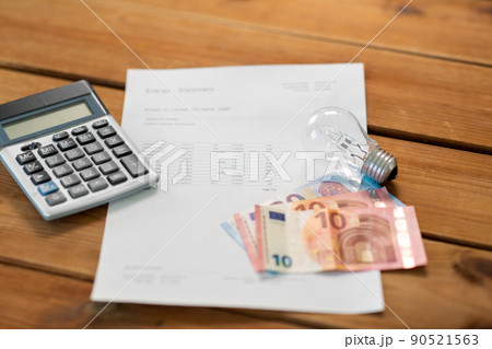 utility bill, calculator, money and lightbulb utility bill, calculator, money and lightbulb 90521563
