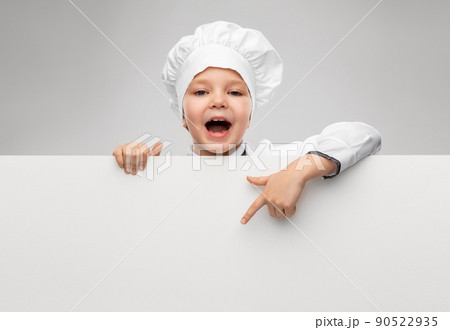 happy little girl in chef's toque with white board happy little girl in chef's toque with white board 90522935