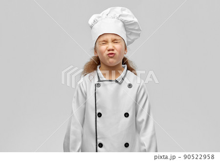little girl in chef's toque and jacket 90522958