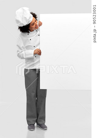smiling female chef with white board smiling female chef with white board 90523001