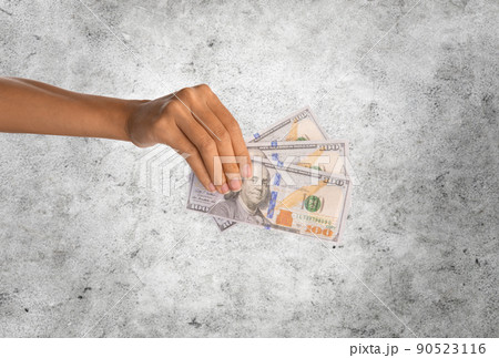 close up of hand holding dollar money close up of hand holding dollar money 90523116