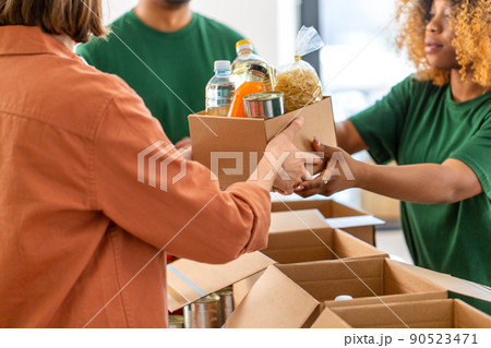 volunteers give food at refugee assistance center 90523471