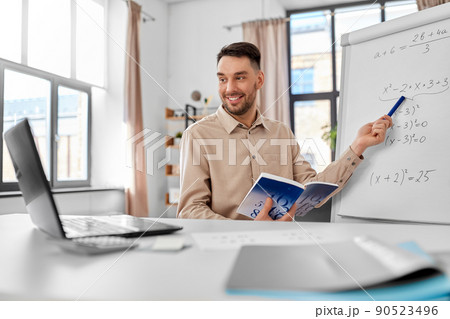 math teacher with laptop has online class at home math teacher with laptop has online class at home 90523496