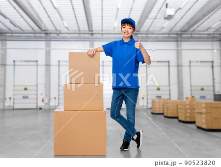 delivery woman with parcel boxes at warehouse delivery woman with parcel boxes at warehouse 90523820