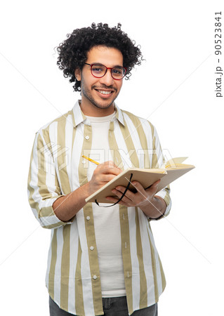 happy smiling young man with diary and pencil happy smiling young man with diary and pencil 90523841