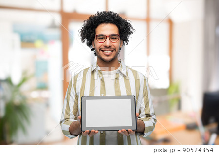 happy young man with tablet pc computer at office happy young man with tablet pc computer at office 90524354