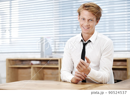 Hes ready for the corporate world. Portrait of a young businessman sitting in his office. 90524537