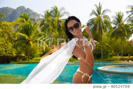 woman in bikini swimsuit with cover-up on beach woman in bikini swimsuit with cover-up on beach 90524709