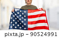 woman with flag of united states of america 90524991