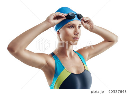 Born to swim. Cropped shot of a young female swimmer isolated on white. 90527643