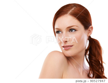 Theres a touch of elegance about her beauty. Studio shot of a redheaded woman isolated on white. 90527947
