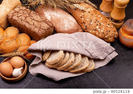 Composition with sourdough bread , rolls and ingredients for baking. Composition with sourdough bread , rolls and ingredients for baking. 90528119