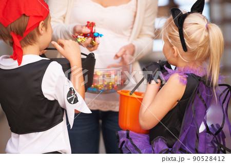 Trick or treat. Shot of children trick or treating. Trick or treat. Shot of children trick or treating. 90528412