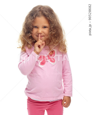 Ssh, I wont tell if you dont. Cute little girl making a ssh gesture against a white background. 90528682