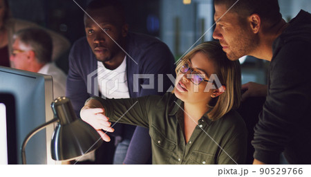 She's got a plan. Cropped shot of a group of businesspeople working together on a computer in their office. She's got a plan. Cropped shot of a group of businesspeople working together on a computer in their office. 90529766