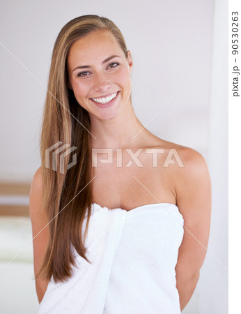 No, it is not hair extensions.... Front view shot of a woman showing off her healthy long hair. 90530263