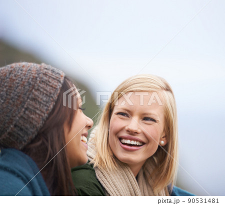 Precious moments with my best friend. Two young women sitting together outside. 90531481