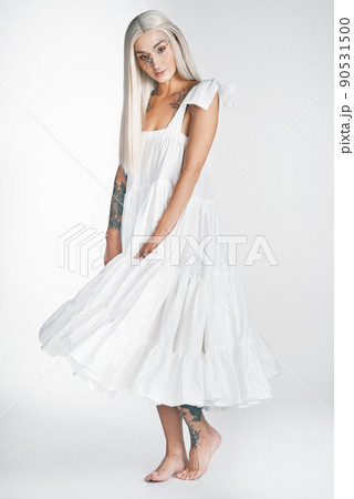 I am beautiful. Full length portrait of an attractive young woman posing against a grey background in studio. 90531500