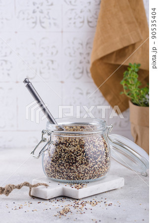 Red, white and brown quinoa. 90535404