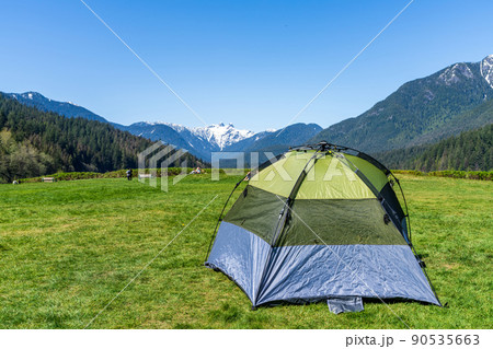 Capilano Lake Cleveland Park in springtime sunny day. Leisure and camping concept. North Vancouver, BC, Canada. Capilano Lake Cleveland Park in springtime sunny day. Leisure and camping concept. North Vancouver, BC, Canada. 90535663