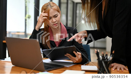 Female office employee gets a complaint and bad feedback from her manager 90536354