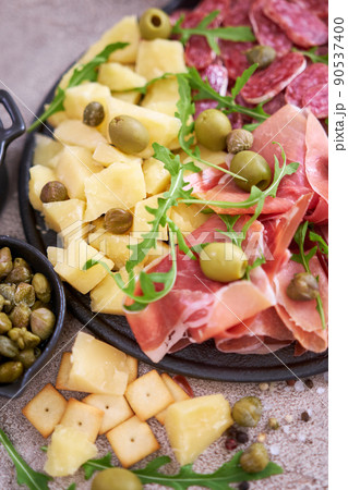 Italian antipasto meat platter - prosciutto ham, bresaola, salami and parmesan 90537400