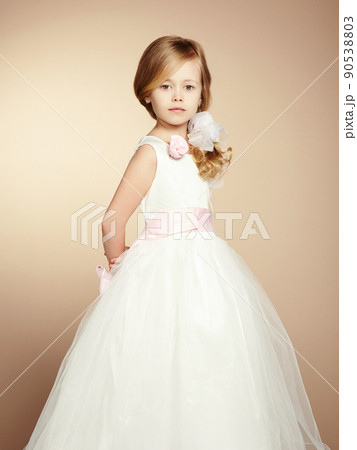 Portrait of little girl in luxurious dress Portrait of little girl in luxurious dress 90538803