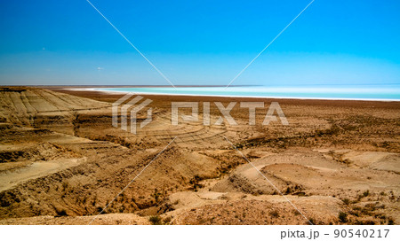 Panorama view to saline Barsa Kelmes lake and Ustyurt plateau in Karakalpakstan, Uzbekistan Panorama view to saline Barsa Kelmes lake and Ustyurt plateau in Karakalpakstan, Uzbekistan 90540217