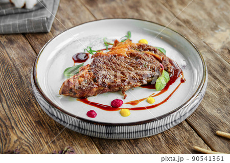 Portion of gourmet grilled beef steak 90541361
