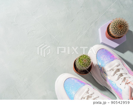 White female pastel sneakers with cactus on turquoise background 90542959