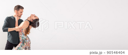 Banner social dance bachata kizomba tango salsa - couple dancing on white background with copy space 90546404