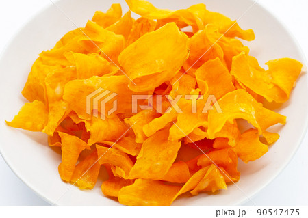Sweet potato chips on white background. Sweet potato chips on white background. 90547475