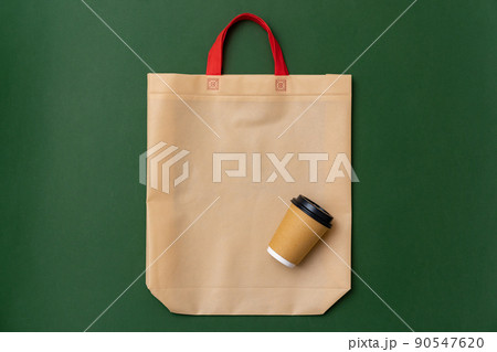 Textile shopping bag and coffee cup flat lay 90547620