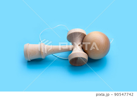 Kendama Ball on blue background. Kendama Ball on blue background. 90547742