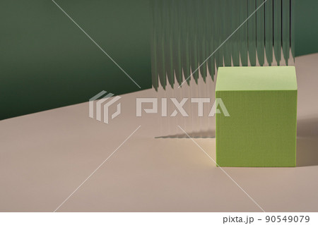 Acrylic ribbed plate, background for cosmetic product packaging on green backdrop. Showcase for jewellery presentation, display for perfume advertising, cosmetics stand minimal branding scene 90549079