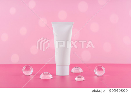 Unbranded cosmetic cream white plastic tube mockup on pink background. Blank body and health care beauty product packaging. Moisturising hand creme bottle with stylish props. Unbranded cosmetic cream white plastic tube mockup on pink background. Blank body and health care beauty product packaging. Moisturising hand creme bottle with stylish props. 90549300