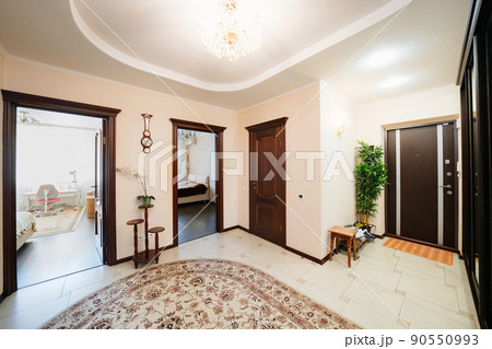 entrance hall with a large mirrored wardrobe and shoe cabinet.  90550993