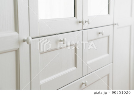 White built-in wardrobe with mirrors. storage and order in the apartment.  90551020