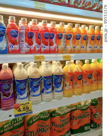 SELANGOR, MALAYSIA -JULY 11, 2021: Selected focused on yogurt drinks and other dairy products displayed for sale in the huge chiller, sorted by the brand to make it easy for the customer to choose. SELANGOR, MALAYSIA -JULY 11, 2021: Selected focused on yogurt drinks and other dairy products displayed for sale in the huge chiller, sorted by the brand to make it easy for the customer to choose. 90551576