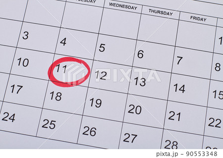 11 day in white paper calendar marked with red lines. 90553348