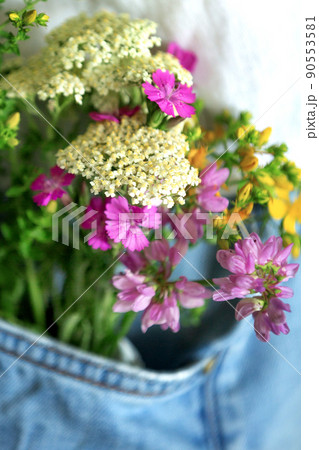 Beautiful tender flowers in front pocket of jeans Beautiful tender flowers in front pocket of jeans 90553581