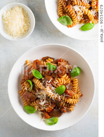 Pasta alla Norma - traditional Italian food with eggplant, tomato, cheese and basil Pasta alla Norma - traditional Italian food with eggplant, tomato, cheese and basil 90554079