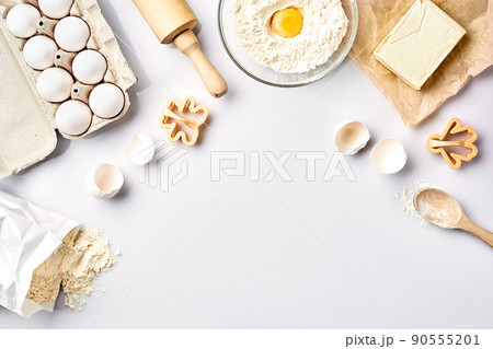 Baking ingredients for pastry on the white table Baking ingredients for pastry on the white table 90555201