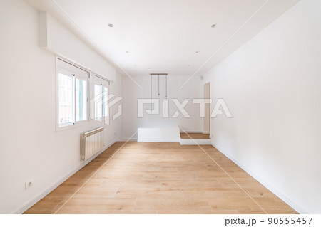 Empty apartment room with wooden floor in a new flat for rent Empty apartment room with wooden floor in a new flat for rent 90555457