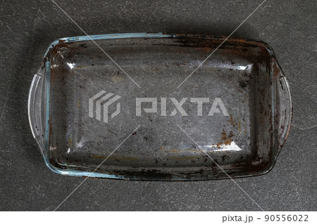 Dirty baking dish with thick layer of carbon Dirty baking dish with thick layer of carbon 90556022